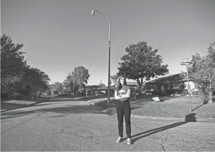  ?? JUSTIN REX/AP ?? Molly Cook, an organizer with Stop TXDOT I-45, stands at the corner of Dowber and Red Ripple roads in Houston where a part of the Interstate 45 expansion is projected to run.