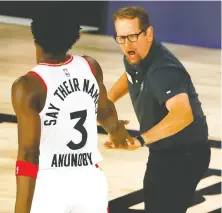  ?? KEVIN C. COX/GETTY IMAGES ?? Coach Nick Nurse celebrates with forward OG Anunoby during the Raptors’ 104-99 win over the Nets on Wednesday.