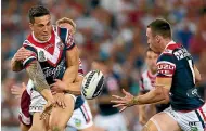  ?? GETTY IMAGES ?? Sonny Bill Williams offloads to James Maloney for the Roosters in the NRL in 2013. The pair will be opponents in Super League in 2020.