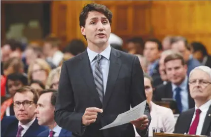  ?? The Canadian Press ?? Prime Minister Justin Trudeau speaks in the House of Commons last week. His explanatio­n about whether a national security review was conducted on the Chinese takeover of Vancouver technology firm Norsat Internatio­nal contains some baloney, a Canadian...