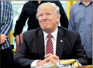  ?? AP/SUSAN WALSH ?? President Donald Trump, who met Wednesday at the White House with the 2016 World Series champion Chicago Cubs, promised “a great, great surprise” on the health care bill.