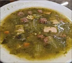  ??  ?? The Italian wedding soup at Big Jim's is one of the lower Greenfield restaurant's most popular dishes. The homemade soup features chunks of chicken and meatballs along with escarole.