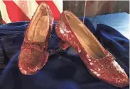  ?? JEFF BAENEN/AP FILE ?? A pair of ruby slippers, one of four known pairs worn by Judy Garland during the filming of “The Wizard of Oz,” were on display at the Judy Garland Museum in Grand Rapids, Minn., before they were stolen in 2005.