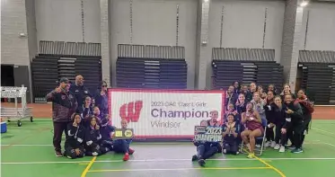  ?? Dan Nowak/Hearst Connecticu­t Media ?? Windsor celebrates winning its seventh straight CIAC Class L Girls Indoor Track team title with 82 points on Friday.