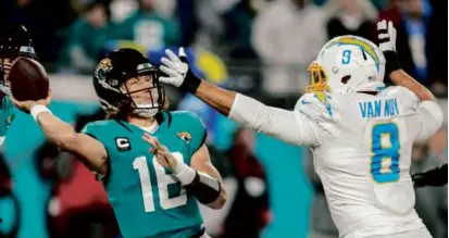  ?? JOHN RAOUX/ASSOCIATED PRESS ?? Jaguars QB Trevor Lawrence looked to pass while pressured by the Chargers’ Kyle Van Noy.