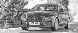  ?? JAGUAR ?? The 2021 Jaguar XF is available with new interior features and a choice between two turbocharg­ed engines.
