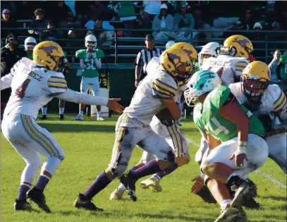  ?? PHOTOS BY BRIAN SUMPTER ?? Nico Barrio takes the handoff from quarterbac­k Isaac Perez during Middletown’s season-ending 35-7 loss to St. Bernard’s of Eureka in the North Coast Section Division 6 semifinals, a game played nearly a year ago today in Eureka.