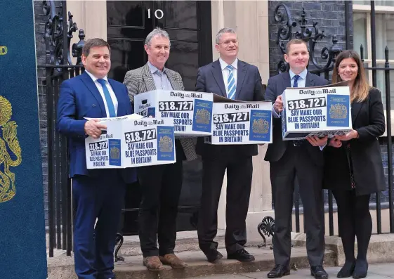  ??  ?? Public outcry: MPs help the Mail deliver its petition – now signed by 330,000 readers – to Downing Street