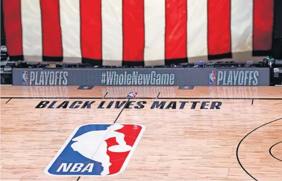  ?? [KEVIN C. COX/POOL PHOTO VIA AP] ?? An empty court and bench are shown following the scheduled start time of Game 5 of the Bucks-Magic playoff series Wednesday in Lake Buena Vista, Fla. All three NBA games scheduled were postponed, with players around the league choosing to boycott in their strongest statement yet against racial injustice.