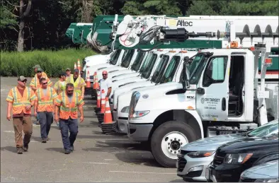  ?? Christian Abraham / Hearst Connecticu­t Media ?? Crews from On Target Utility Service in Maine stage at Christ the King Catholic Church in Trumbull in August 2020.