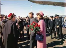  ?? ?? DALLAS: This file photo taken on Nov 22, 1963 shows US President John F Kennedy and Jacqueline Kennedy arriving at Love Field. —AFP
