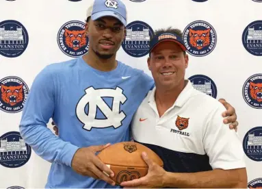  ?? PROVIDED ?? Evanston linebacker Sebastian Cheeks, with Wildkits coach Mike Burzawa, committed to North Carolina last week.