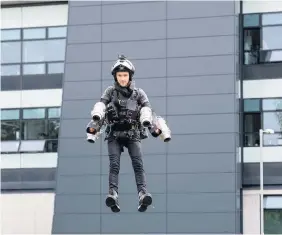  ?? Gareth Nunns ?? Sam demonstrat­ing the world’s fastest jet-powered suit at Loughborou­gh University Design Show. Left, Sam living out his childhood dream