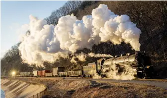  ?? Walter Scriptunas II ?? Sunrise on Sunday, Feb. 27, 2022, sees No. 1309 and its freight greet the day in the Narrows, just west of Cumberland, Md. This is where Wills Creek, the preservati­on railway, U.S. 40, and CSX’s former Baltimore & Ohio main line all squeeze through a narrow mountain gap.