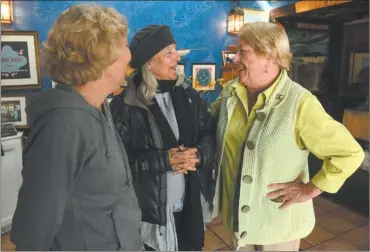  ?? DANA JENSEN/THE DAY ?? Ainslie Turner, right, owner of Skipper’s Dock restaurant in Stonington borough, talks to longtime customer Paula Heckman and Heckman’s friend Meg Mitchell, both of Branford, Monday at the restaurant. Skipper’s Dock will be closing at the end of the...