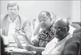  ?? Nikki Boertman/ the Commercial Appeal ?? memphis City council member myron lowery (center), questions an expert from the Segal Company tuesday during a presentati­on on the city’s pension problems.