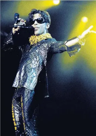  ?? Tim Mosenfelde­r Getty Images ?? HIS EYE-CATCHING eyewear was among the best of any performer this side of Elton John.