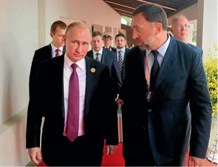  ?? PHOTO: AP ?? Russian metals magnate Oleg Deripaska, right, is among dozens of Russian oligarchs and government officials targeted by new US sanctions aimed at the inner circle of Russian President Vladimir Putin, left, as the Trump administra­tion tries to show that it is not afraid to take tough action against Moscow.