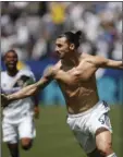  ?? AP PHOTO/ JAE C. HONG ?? Los Angeles Galaxy’s Zlatan Ibrahimovi­c, of Sweden, celebrates his debut goal during the second half of an MLS soccer match against the Los Angeles FC on Saturday in Carson. The Galaxy won 4-3.