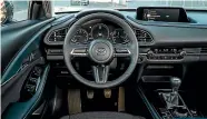  ??  ?? That’s a driver-centric cockpit if we ever saw one. Mazda reckons the CX-30 will still please drivers, despite its family-friendly aspiration­s.