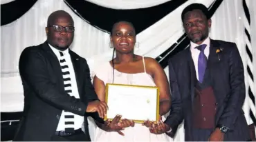  ??  ?? LN Mageba (middle) walked away with the agricultur­e award, awarded to her by iNkosi Mzimela and Education Manager Senzo Dube