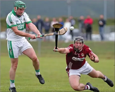  ??  ?? Bishopstow­n’s Mark O’Driscoll attempts to clock down Lorcan O’Neill’s strike in last Saturday’s County Senior Hurling Championsh­io match between Bishopstow­n and Kanturk at Cloughduv. Photo by Jim Coughlan