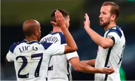  ?? Photograph: Clive Rose/ EPA ?? Harry Kane celebrates with Lucas Moura and Matt Doherty after scoring the second goal of his hat-trick for Tottenham against Maccabi Haifa with a penalty.