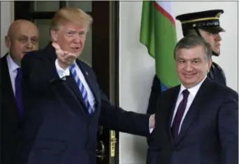  ?? SUSAN WALSH — THE ASSOCIATED PRESS ?? President Donald Trump greets Uzbek President Shavkat Mirziyoyev outside the West Wing of the White House in Washington, Wednesday.