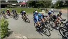  ?? EVAN BRANDT — MEDIANEWS GROUP ?? Racers in the first women’s race of the day round the corner of Beech and Mount Vernon streets Saturday during the Pottstown Criterium bike race.