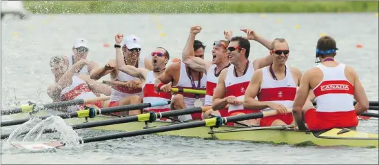  ?? Jean Levac/postmedia News ?? The Canadian men’s eight rowing team celebrates a silver medal in London on Wednesday after having to fight for a spot in the final at the 2012 Summer Games.