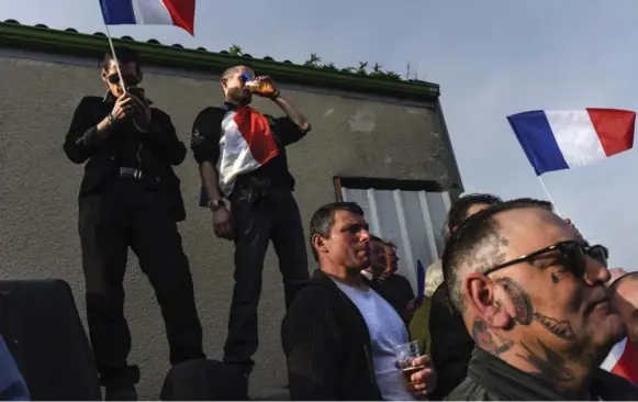  ?? MICHAEL ROBINSON CHAVEZ PHOTOS/THE WASHINGTON POST ?? Supporters of far-right candidate, Marine Le Pen, gather for a rally in La Trinité-Porhoë, a rural town in France. Le Pen enjoys a commanding lead among France’s youngest voters, polls show.