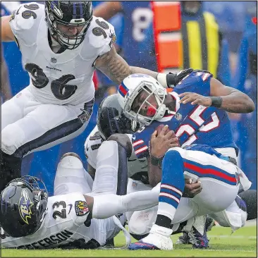  ?? PATRICK SMITH/GETTY IMAGES ?? Bills running back LeSean McCoy, getting mauled by the Ravens in last weekend’s blowout loss, has tried to point out to his teammates that they lost a game in similar fashion last season, and still rebounded to make the playoffs.