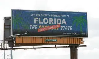  ?? JOHN RAOUX/AP ?? Critics of the original law used an Orlando billboard in April to welcome visitors to “Florida: The Sunshine ‘Don’t Say Gay or Trans’ State.”