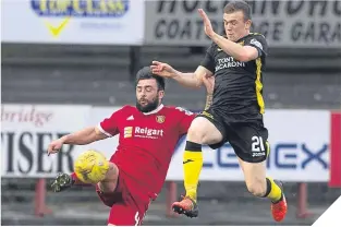  ??  ?? Albion Rovers’ Gary Fisher (left) tussles with Livingston’s Liam Watt.