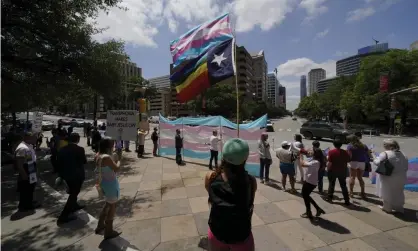  ??  ?? Demonstrat­ors gather on the steps to the state capitol to speak against transgende­r related legislatio­n bills being considered in the Texas senate and Texas house, on 20 May 2021, in Austin, Texas. Photograph: Eric Gay/AP