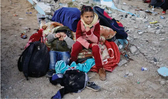  ?? Reuters ?? Palestinia­n children in Rafah, southern Gaza, after having to leave Nasser Hospital in Khan Younis. Israeli forces have turned the hospital into a ‘military site’