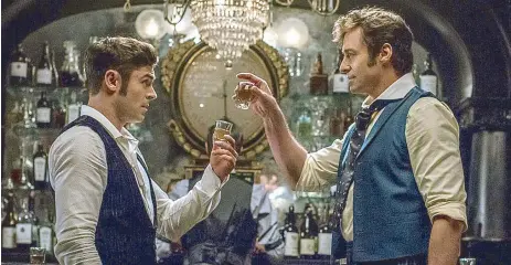  ??  ?? Zac Efron (left) and Hugh Jackman in the musical film based on the life of P.T. Barnum