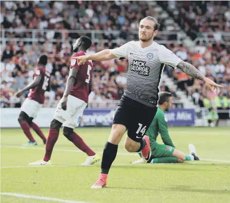  ??  ?? Jack Marriott celebrates scoring his goal against Northampto­n.