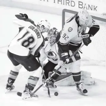  ?? Mark Humphrey, The Associated Press ?? Avalanche defenseman Cody Goloubef and Predators center Ryan Johansen fight for a rebound in front of Colorado goalie Semyon Varlamov in the third period Tuesday.