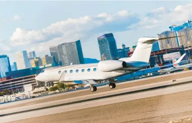  ?? CODY COBB/THE NEW YORK TIMES ?? A private jet lands Feb. 10 at a Las Vegas airport. The Biden administra­tion is scrutinizi­ng corporate jets.