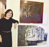  ??  ?? Dr. Joy Abueva Rizaari, niece of the late National Artist for Sculpture Napoleon Abueva, beside her uncle’s sculptures in a wooden frame made of kamagong, narra and bronze. (From the collection of the Rasul family.)
