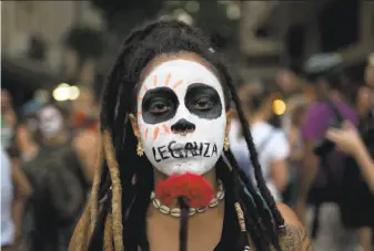  ?? Silvia Izquierdo / Associated Press 2017 ?? A woman with the word “Legalize” painted on her mouth marched in November in Rio de Janeiro against a congressio­nal committee vote to make abortion illegal without exception.