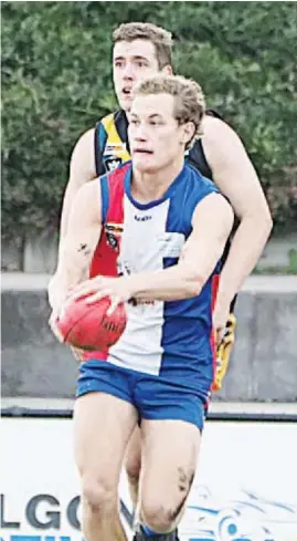  ??  ?? Tom Barr, one of three Drouin players that represente­d Gippsland and making his senior inter-league debut, gains some space and looks for a leading target.