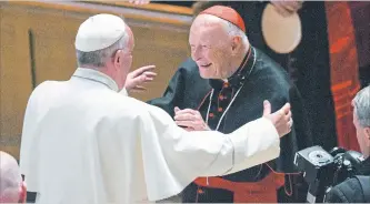  ?? JONATHAN NEWTON ASSOCIATED PRESS FILE PHOTO ?? Pope Francis reaches out to hug Cardinal Archbishop emeritus Theodore McCarrick at the Cathedral of St. Matthew the Apostle in Washington. The cardinal is accused of sexually abusing boys and adult seminarian­s.