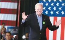  ?? Yards in Atlanta, Georgia, Saturday.
EPA-Yonhap ?? U.S. President Joe Biden waves to supporters during a re-election campaign event at Pullman