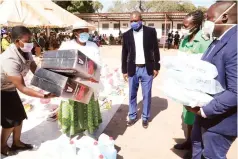  ??  ?? First Lady Auxillia Mnangagwa (second from left) hands over knapsack sprayers, sanitisers and other personal protective equipment to Binga District Hospital acting medical officer Dr Simbarashe Manjengwa (right) and acting matron Maria Mudimba, while Matabelela­nd North Provincial Affairs Minister Richard Moyo look on yesterday