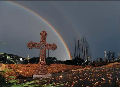  ?? WALLY SKALIJ/LOS ANGELES TIMES ?? A rainbow rises above the empty lots at Mark West Estates in Santa Rosa on Wednesday.