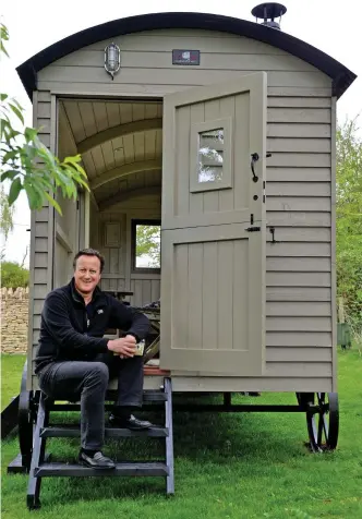  ??  ?? Writer’s retreat: David Cameron with the designer hut at his Cotswold home