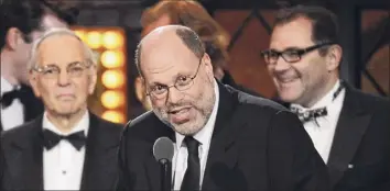  ?? Charles Sykes / Associated Press ?? Producer Scott Rudin, center, one of the most successful and powerful producers, has long been known for his torturous treatment of assistants. Rudin has announced he will “step back.”