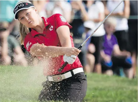 ?? PHOTOS: JONATHAN HAYWARD/THE CANADIAN PRESS ?? Brooke Henderson is tied for second heading into Saturday at the CP Women’s Open in Regina.